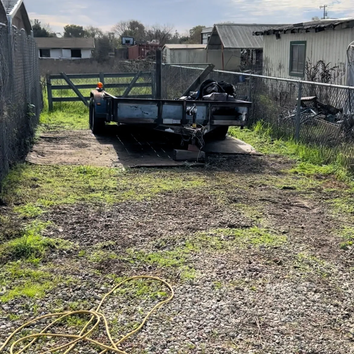 Same property lot cleared down to bare ground after scrap haul-off